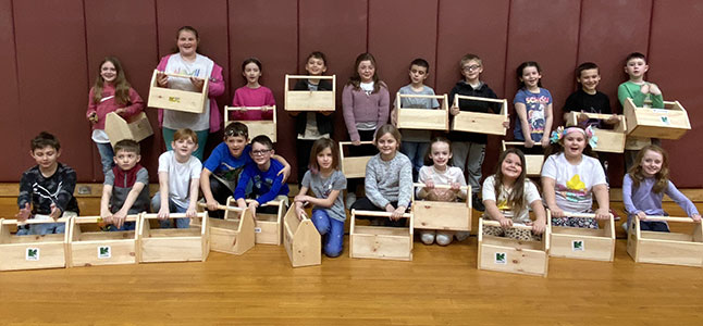 group of students of holding their toolboxes