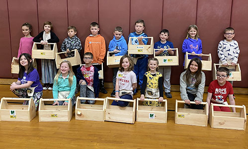 group of students of holding their toolboxes
