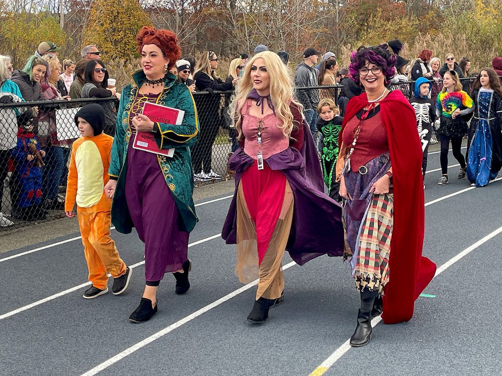 Three teachers dressed as the Sanderson sisters from the movie "Hocus Pocus."