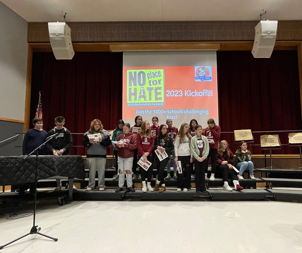 Group of students standing on stage.