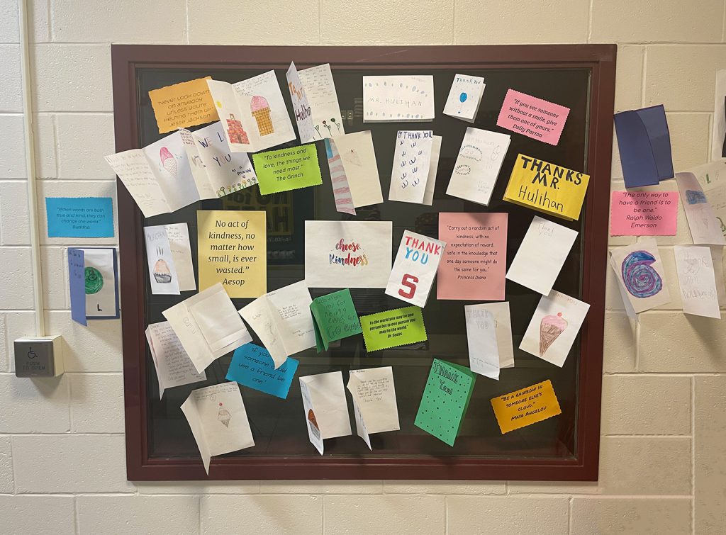 School window decorated with handmade cards.