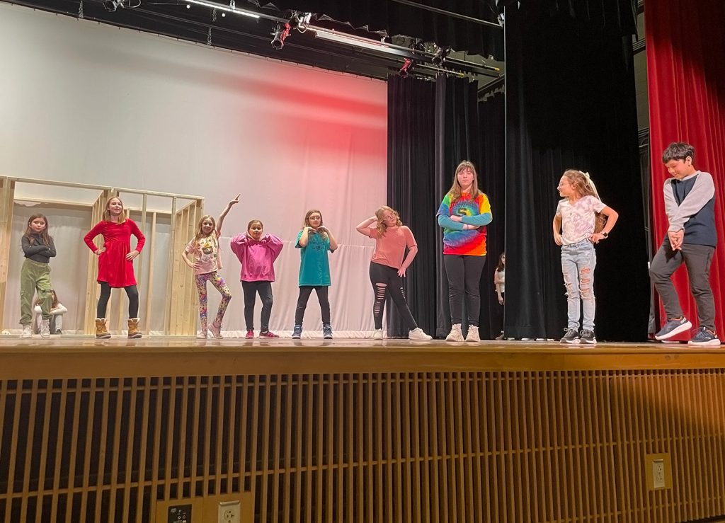 Students dancing on stage.