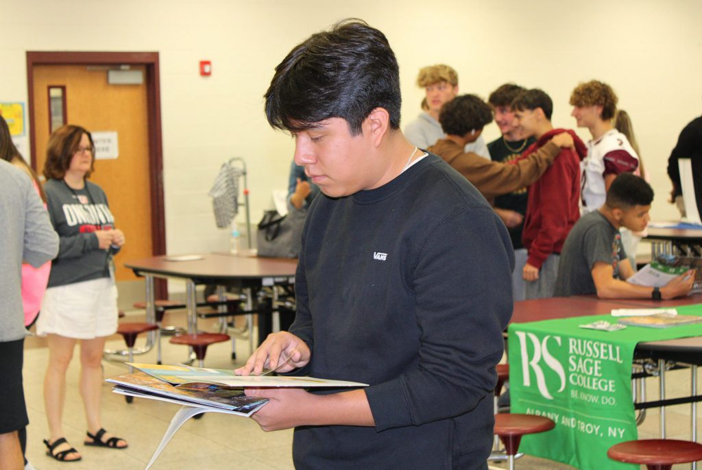 Student invested in some papers and folders.