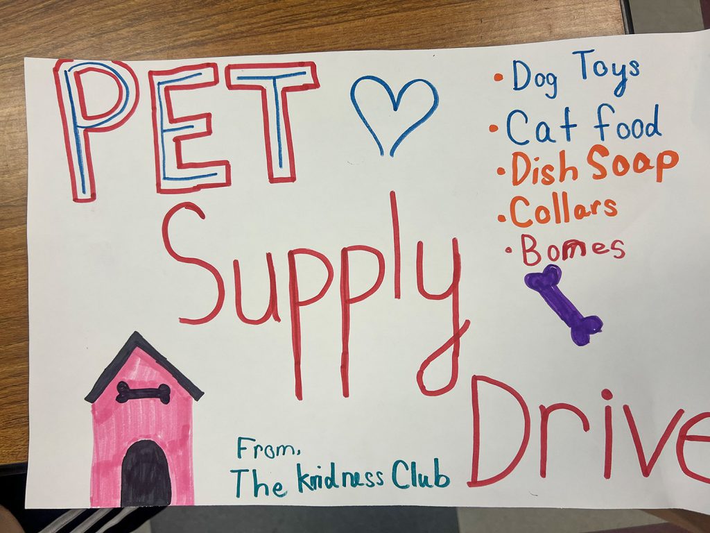 Poster: "Pet Supply Drive" with list of supplies needed.