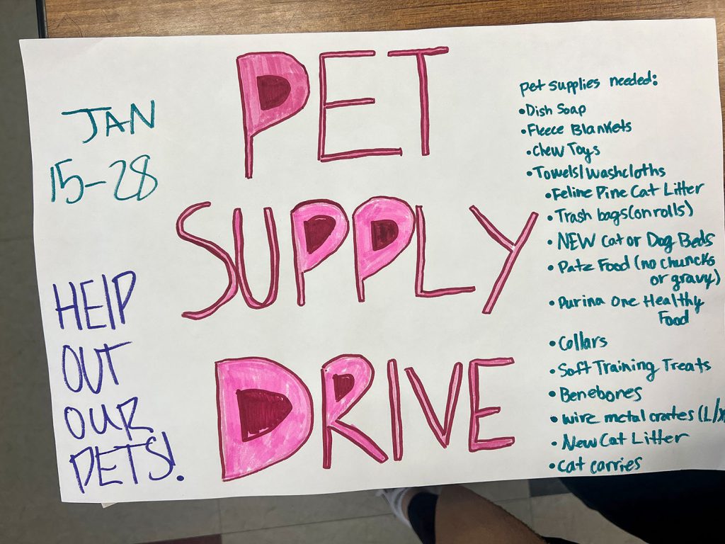 Poster: "Pet Supply Drive" with list of supplies needed.