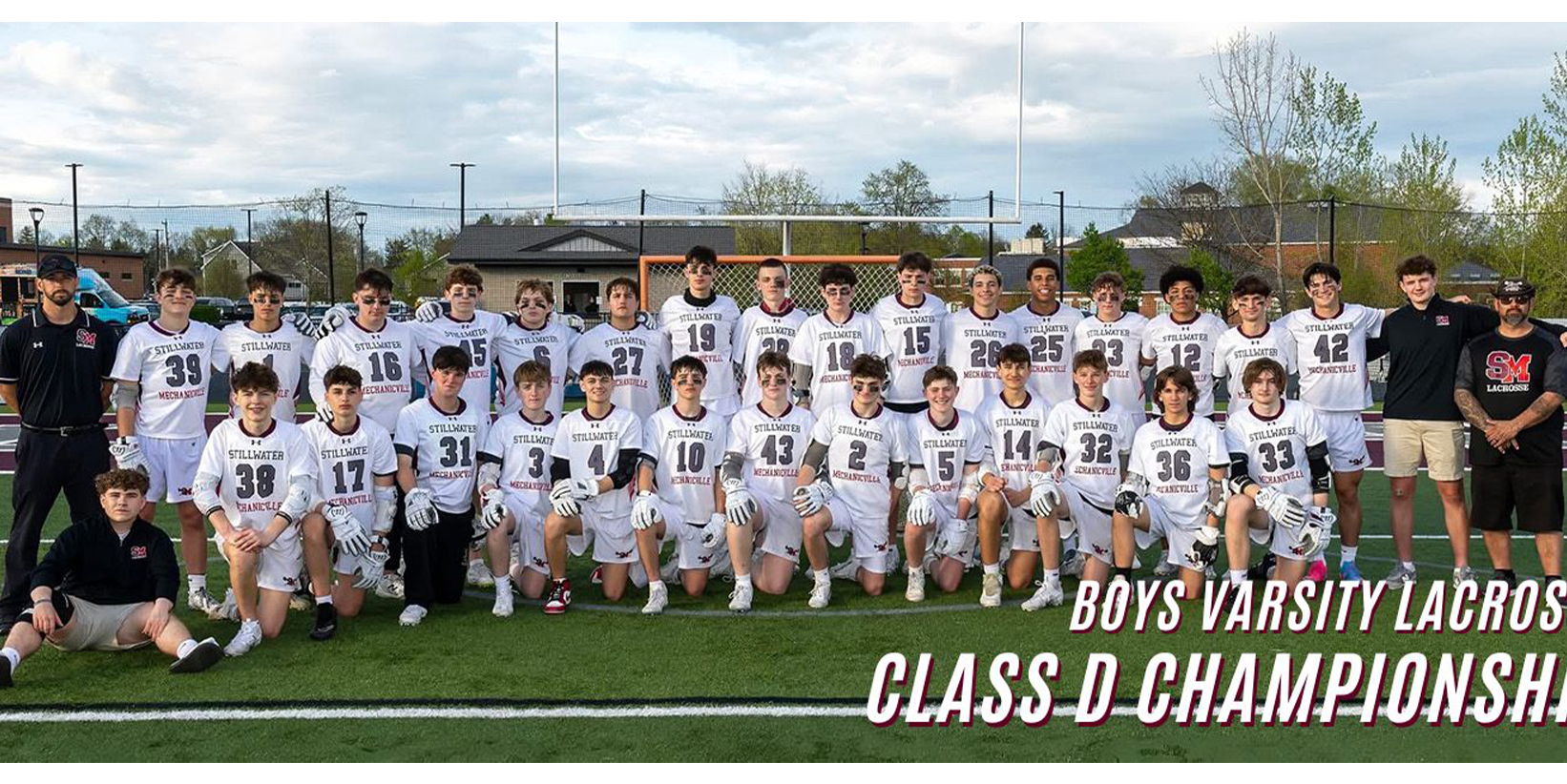 lacrosse team posing for photo