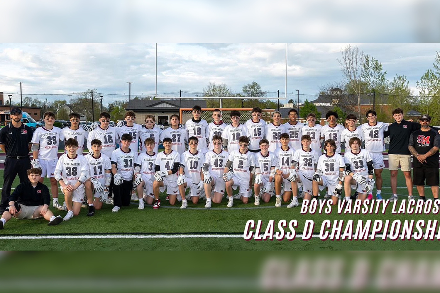 lacrosse team posing for photo