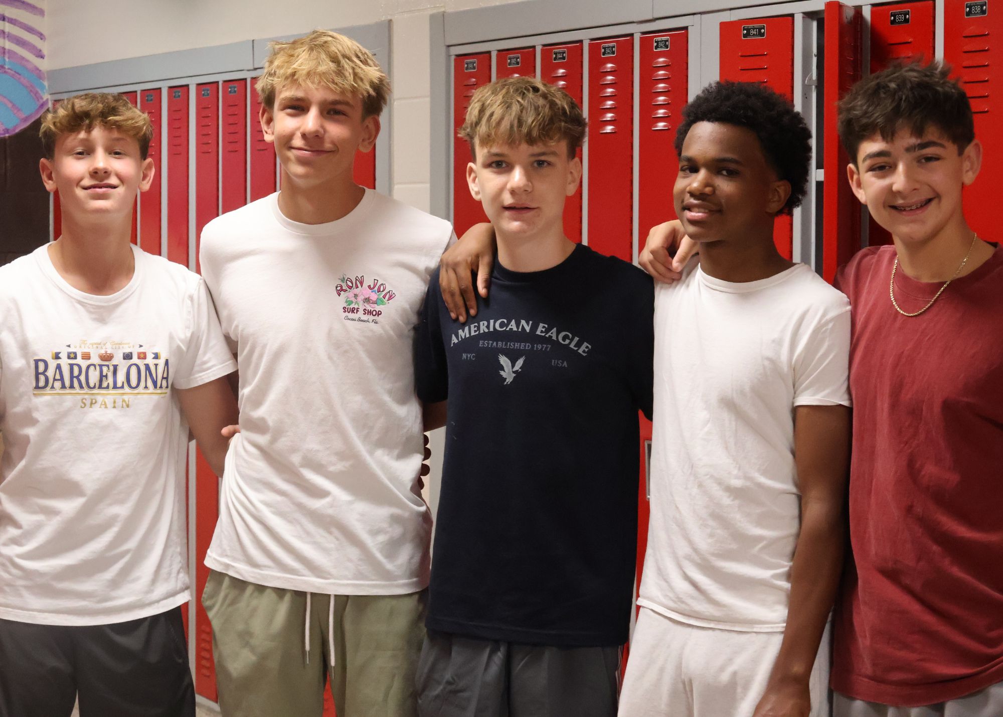 Group of 5 students engaged in an activity.