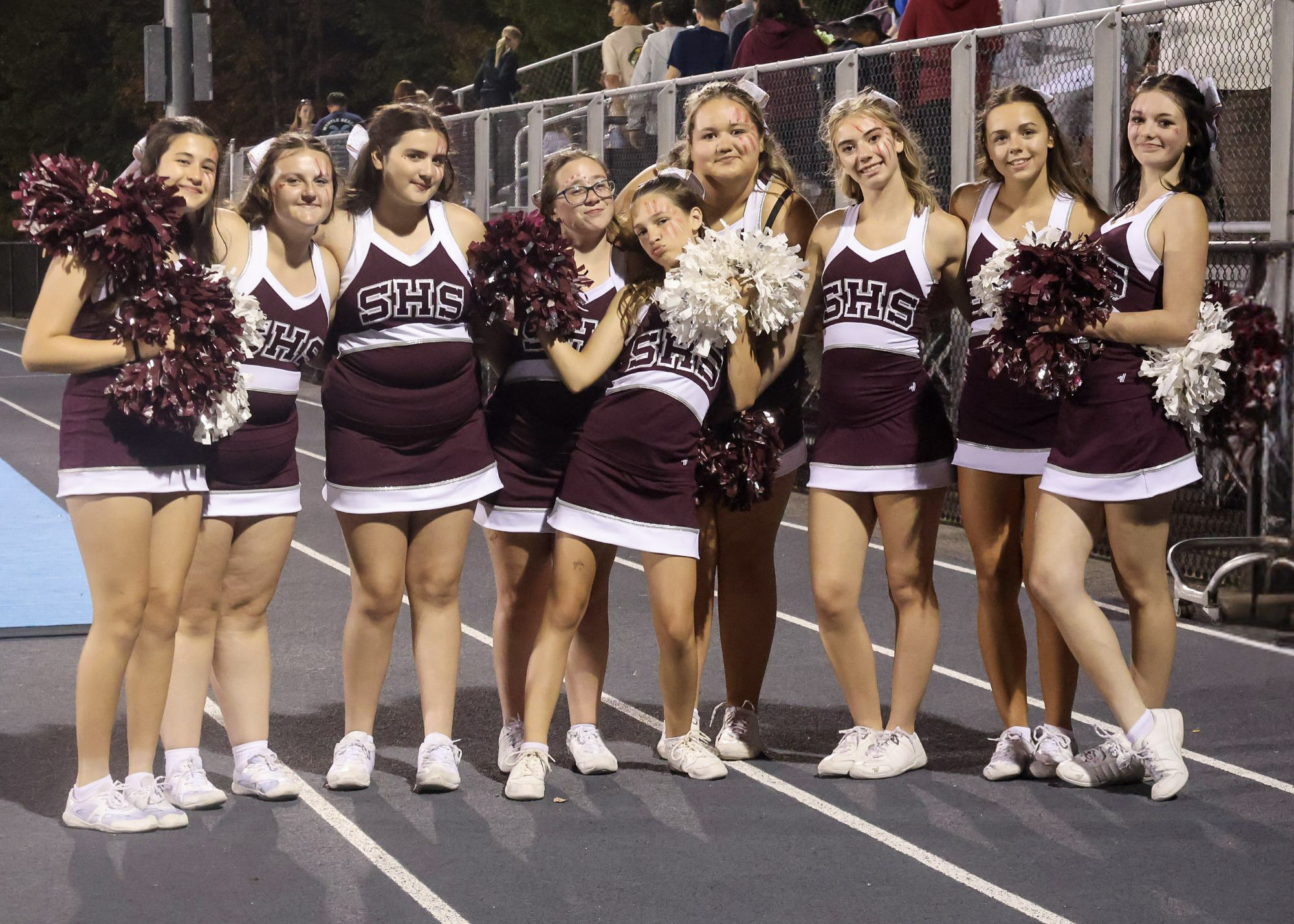 cheerleaders cheering in gymnasium