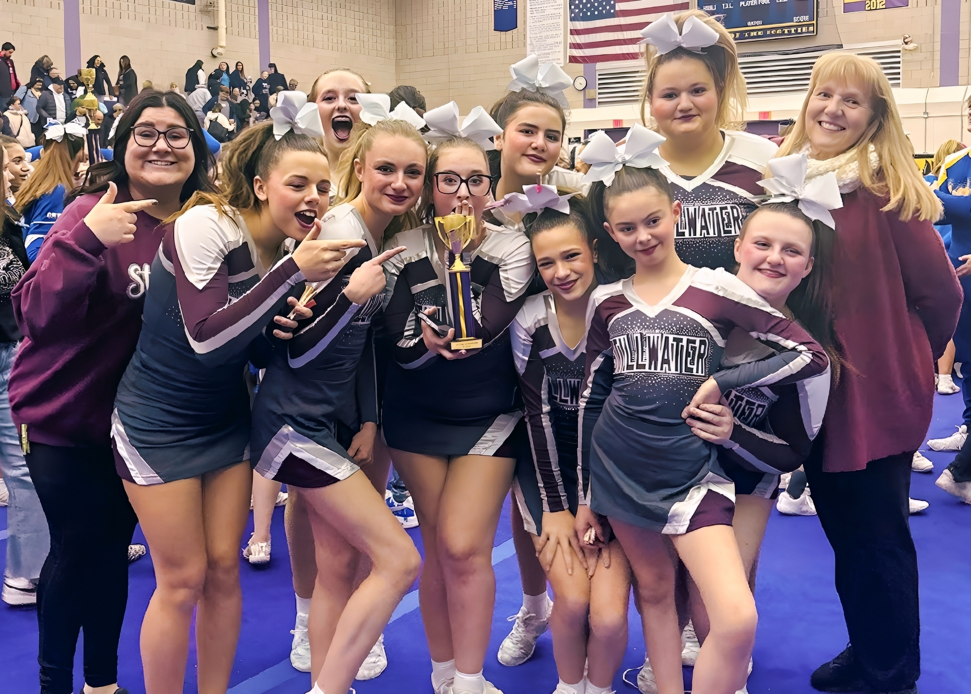 soccer team posing with banner that says sectional 2