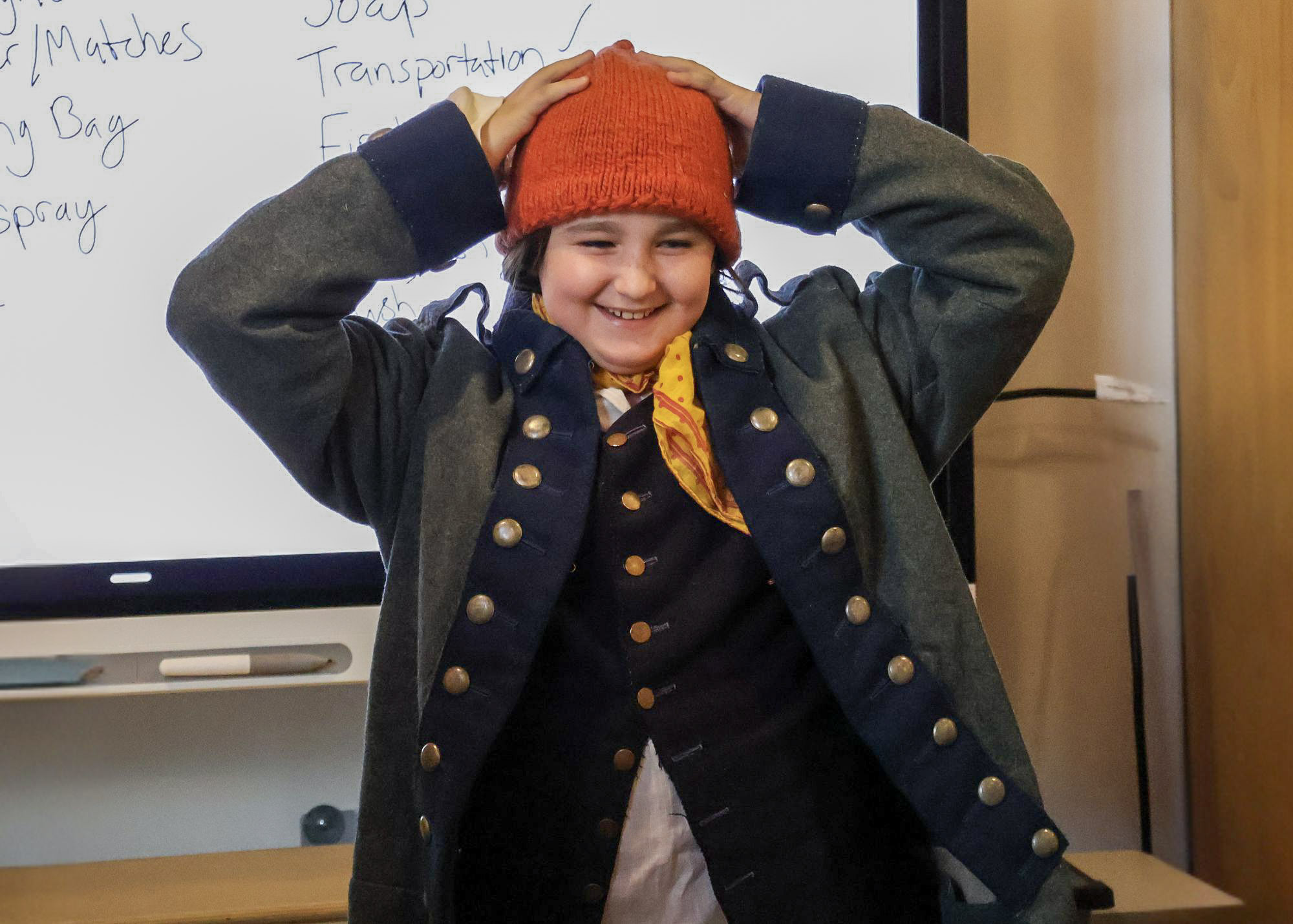 young students doing christmas crafts
